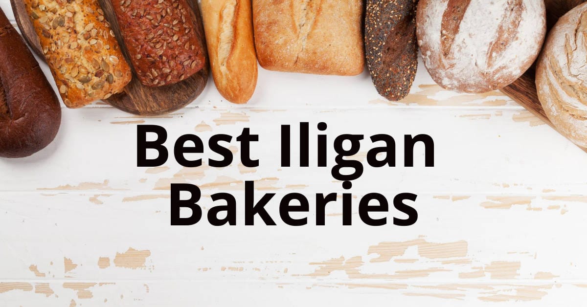 Assorted breads on a white wooden surface with Best Iligan City Bakeries text overlay.